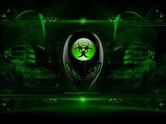 a green and black wallpaper with a biohazard symbol on it's face