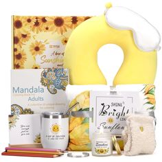 the sunflowers and other items are on display in this gift box for adults