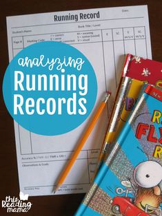 a book and pen sitting on top of a desk next to a paper with the title how to check compreension with running records