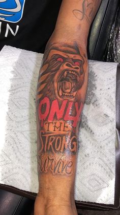 a person with a bear tattoo on their arm