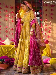 Yellow Bridal Dress in Traditional Pishwas Style is a stunning attire that steals everyone's hearts at the very first glance. This beautiful Mehndi Dress is hand-embellished with fine adornments and traditional designs to create a breathtaking Pakistani Bridal Dress for the wedding day. You can pair the Pishwas with Lehenga or churidar on customized orders. Pishwas: Traditional Pishwas in the alluring yellow shade has a premium quality Chiffon fabric. This stunning Pishwas Dress is beautifully e Mayoon Dresses, Nameera By Farooq, Pakistani Bridal Lehenga, Pakistani Mehndi, Pakistani Bridal Dress, Mehndi Dress, Lehenga Gown, Pakistani Party Wear, Pakistani Wedding Dress