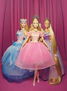 three barbie dolls standing next to each other in front of a pink background with curtains