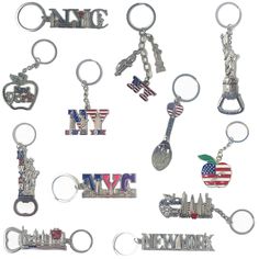 many different key chains with the words new york and american flags on them, all in various shapes and sizes