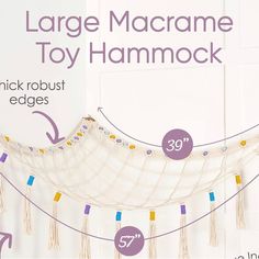 a white hammock with tassels hanging from it's sides and measurements