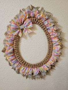 a wreath made out of burlocks and ribbons