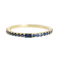 A luminously blue ring, set chock-full with sapphires. A very fancy stacking ring (yes please!), a subtle wedding band to sneak under your engagement ring, OR a wedding band and engagement ring, all in one! Financing options available in partnership with Affirm. Sapphire Eternity Ring, Cool Wedding Rings, Antique Wedding Rings, Ring Sapphire, Sapphire Band, Stones Jewelry, Pear Engagement Ring, Rings Fashion, Blue Sapphire Rings