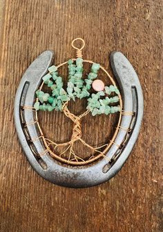 a metal horseshoe with some beads on it