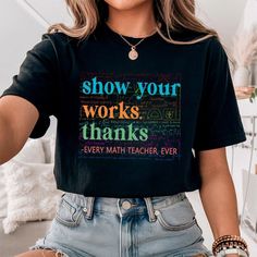 a woman wearing a black t - shirt that says show your works thanks every math teacher ever