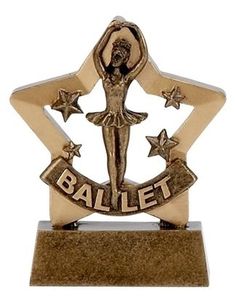 a gold trophy with a ballerina figure on it's side and stars around the base