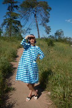 Part of a series of vintage inspired dresses, this deceptively simple blue and white gingham silk dress is a take on a 60s mod look, with a modern twist: pockets. Blue gingham silk featuring 3/4 sleeves and front pockets. Blue Knee-length Plaid Dress For Spring, Blue Knee-length Plaid Summer Dress, Blue Plaid Dress For Spring Picnic, Blue Midi Dress For Picnic, Retro Blue Dress For Picnic, Blue Plaid Summer Midi Dress, Blue Plaid Midi Dress For Summer, Gingham School Dress, Mod Look