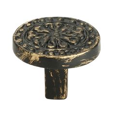 an antique brass knob with ornate designs on it