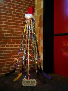 a christmas tree made out of hockey sticks