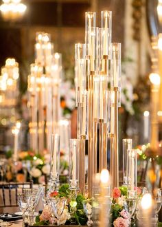 an elegant table setting with candles and flowers