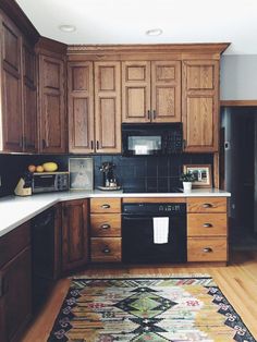 the kitchen is clean and ready for us to use it's new rugs