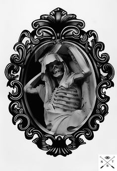 a black and white photo of a skeleton in a frame with an ornate border around it