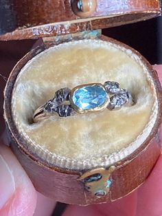 The soft, oceanic hues of this antique aquamarine ring transport one back to the Regency era of Jane Austen.  The luscious blue turquoise color softens and heightens depending on the intensity of the lighting, but the underlying foiling gives a soft glow from within in every type.  Likely English in origin, though mimicking a French design. Size 6. A very rare collector's piece! Antique Aquamarine Ring, Antique Jewelry Rings, Antique Diamond Rings, Regency Era, Antique Ring, Aquamarine Ring, Aquamarine Rings, Cute Rings, Multi Stone Ring