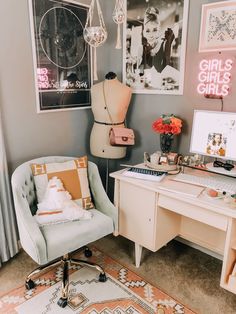 a chair and desk in a room with pictures on the wall