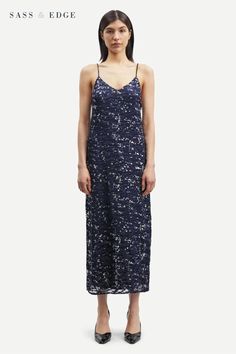 luxurious devoré burnout fabric with a sophisticated printed pattern with striking silver splashes. Its slim fit and low-cut back provide a flattering silhouette, while its delicate rouleau straps and adjustable tie fastening lend an elegant touch Sally Dress, Burnout Fabric