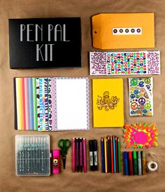 the contents of a pen pal kit laid out on a table