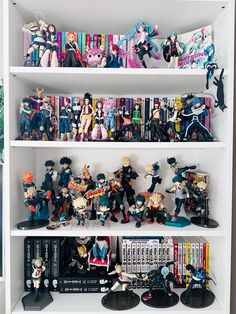 a book shelf filled with anime figurines and toys