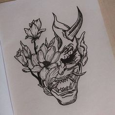 a drawing of a skull with flowers in it's mouth and horns on its head