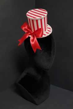 This is a red and white striped mini top hat made of a red and white stripe fabric molded to a handmade poly interfacing hat form from my own pattern. The piece is trimmed with white gimp trim and a red satin bow on the side. The piece secures to the head with two alligator clips on the underside. *Note - The piece will now be made with a red and white stripe cotton fabric with striped that are slightly but minimally larger! :) *Made to order - Each piece is typically finished between 1-3 busine Boardwalk Carnival, Hat Form, Mini Top Hat, Mini Top, Stripe Fabric, County Fair, Alligator Clips, White Hat, Satin Bow