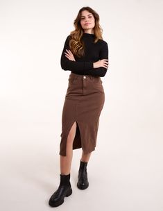 Who said denim skirts are only to be worn in hot weather? Team this brown midi skirt with an oversized t-shirt, sheer tights, and ankle boots. 97% Cotton, 3% Elastane Made in China Machine washableFront and back pockets Button front Model wears a size: SModel height: 5ft 7.5 / 171cm Brown Skirt For Fall, Relaxed Denim Skirt For Workwear In Fall, Brown Midi Length Bottoms For Work, Brown Midi Length Workwear Bottoms, Knee-length Cotton Denim Skirt For Fall, Brown Lined Skirt For Fall, Relaxed Casual Denim Skirt For Fall, Casual Relaxed Denim Skirt For Fall, Trendy Lined Denim Skirt For Fall