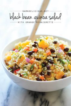 a white bowl filled with black bean quinoa salad