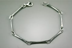 This modern style bracelet is made with sterling silver ; its line are subtle and clean, original yet simple at the same time. A unique design, drawn and made by the artist for people who like simple and clean jewelry.  A ideal present  for birthday(anniversary), Mother's Days, wedding, Christmas or to offer itself to oneself! matching earrings : https://www.etsy.com/ca/listing/220008855/silver-modern-women-earring-minimalist?ref=shop_home_active_22 matching necklace : https://www.etsy.com/ca/listing/204798398/silver-handmade-chain-silver-chain?ref=shop_home_active_20 All orders in standard shipping service are sent with no tracking numbers, if you need a specific date or track your items select a different shipping option. Because the environment means a lot to me just like you, all my je Silver Necklace Designs, Silver Ring Designs, Cleaning Silver Jewelry, Bracelet Minimalist, Minimalist Women, Jewelry Simple, Women Bracelet, Simple Bracelets, Silver Jewels