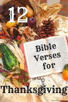 an open bible sitting on top of a table covered in leaves and other items with the text 12 bible verses for thanksgiving