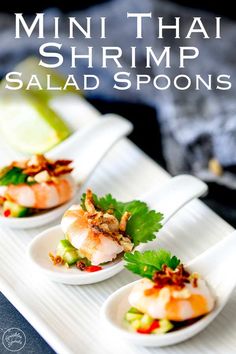 mini thai shrimp salad spoons on a white plate