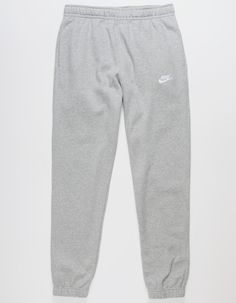 Nike Sportswear Club Fleece Sweatpants. Combines Classic Style With The Soft Comfort Of Fleece. Standard Fit Has A Relaxed, Easy Feel. Tapered Leg. Elastic Waistband. Side Pockets. Embroidered Logo On Left Leg. Elastic Cuffs. Fleece Lining. 80% Cotton 20% Polyester. Machine Wash. Imported. Grey Nike Sweatpants Outfits, Nike Sweatpants Outfit, Grey Nike Sweats, Jogging Nike, Grey Nike Sweatpants, Sweatpants Nike, Cute Sweatpants, Nike Sportswear Club Fleece, Cute Nike Outfits