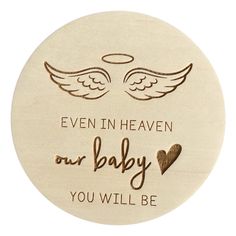 a wooden plaque with the words even in heaven our baby you will be