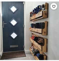 there is a blue door and some shoes on the shelves in front of the door