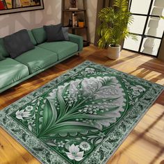 a living room with green couches and a large rug on the floor in front of it