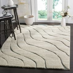 a white rug with wavy lines on it