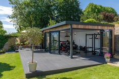 an outdoor gym with exercise equipment in the back yard