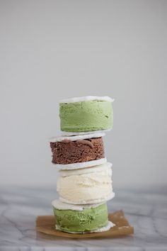 four different types of ice cream stacked on top of each other in a stack,