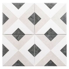 a white and grey tile with black squares on it's sides, in the shape of diamonds