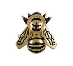 a gold and black bee with horns on it's back end, sitting against a white background