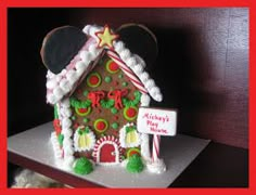 a gingerbread house decorated to look like mickey mouse