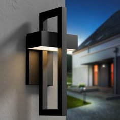 a modern outdoor wall light on the side of a house