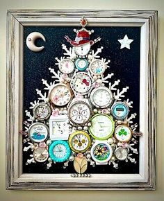 a christmas tree made out of clocks and snowflakes is displayed in a frame