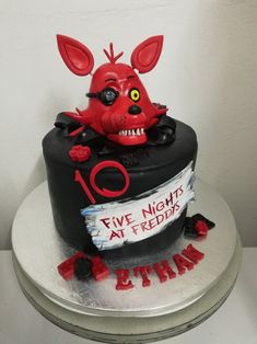 a birthday cake with an animal head on top that says five nights at reddish