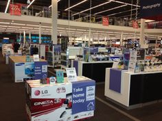 the inside of a store filled with lots of electronics and books on display for sale