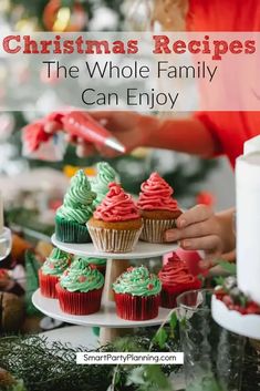 christmas cupcakes on a cake stand with the words christmas recipes the whole family can enjoy