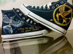 a pair of shoes with the words, may the odds be in your favorite