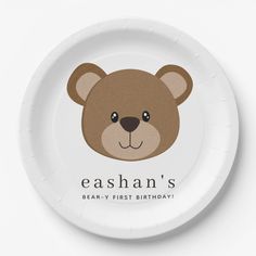 a white paper plate with a brown bear face on it's side and the words eashan's