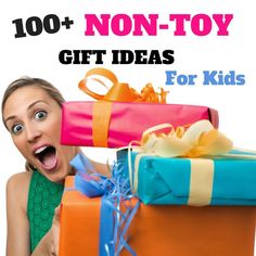 a woman holding two wrapped presents with the words, 100 + non - toy gift ideas for kids