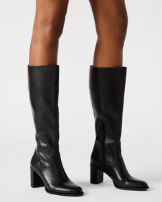 Step up your style with the JOVANA knee-high block heel boot. Crafted with a rounded toe, these boots offer both comfort and sophistication. The perfect addition to any outfit, these boots will elevate your look with their sleek design and sturdy heel. 2.75 inch heel height Size 6 measurements: 14.5 inch shaft circumference, 14.25 inch shaft height Size 8 measurements: 15.5 inch shaft circumference, 15.25 inch shaft height Size 10 measurements: 16.5 inch shaft circumference, 16.25 inch shaft hei Black Boots Women Outfit, Knee High Leather Boots Outfit, Black Calf Boots, Steve Madden Black Boots, Leather Boots Outfit, Black Boots Outfit, Heel Boot, Black Knee High Boots, Block Heel Boots